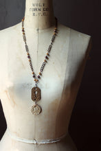 Load image into Gallery viewer, Honeystalks Bakery. Storyteller Series. Ceramic Pendant, Czech Glass and Sandalwood Necklace.