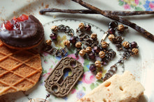 Load image into Gallery viewer, Honeystalks Bakery. Storyteller Series. Ceramic Pendant, Czech Glass and Sandalwood Necklace.
