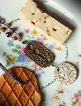 Load image into Gallery viewer, Honeystalks Bakery. Storyteller Series. Ceramic Pendant, Czech Glass and Sandalwood Necklace.