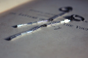 Frosted Boughs. Hand Strung Tube Bead & Gunmetal Linear Earrings.